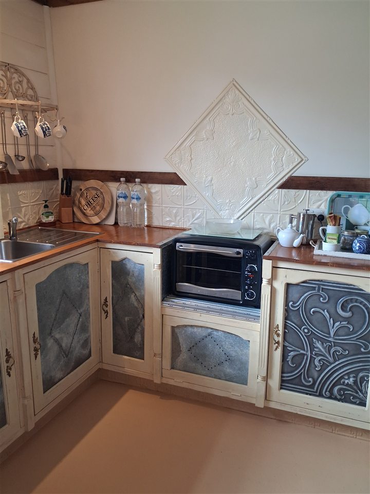Detailed cabinetry in the La Petite Maison kitchenette